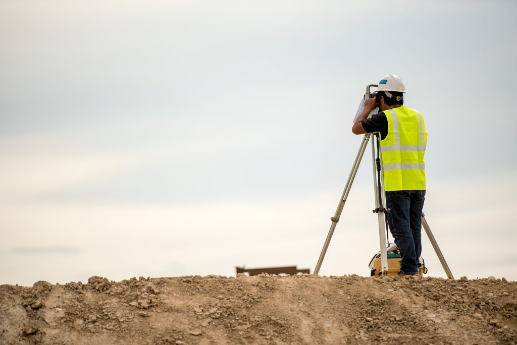 theodolite mark a concrete pile